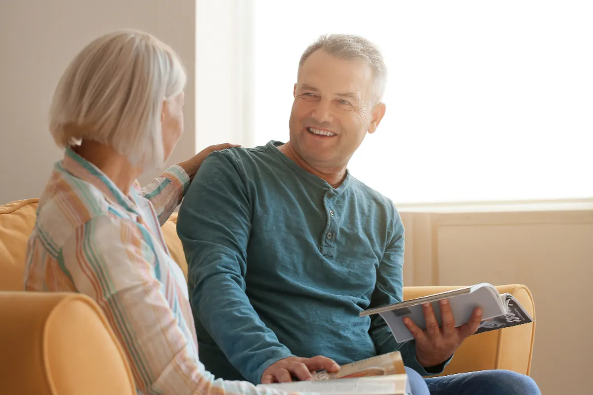 An older couple relaxing on their sofa at home in Wolverhampton